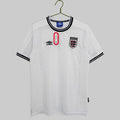 A white England national football team home shirt with a crew neck collar, short sleeves, and a small crest on the chest.