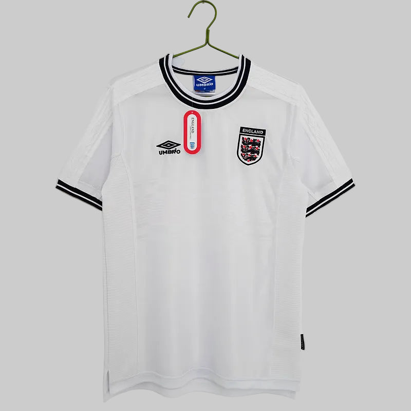 A white England national football team home shirt with a crew neck collar, short sleeves, and a small crest on the chest.