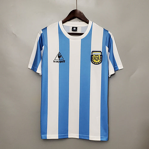 Argentina 1986 Home retro football shirt hanging in The Retro XI locker room with sky blue and white vertical stripes